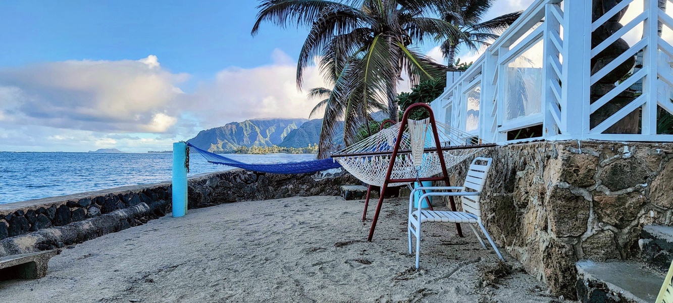 Enjoy sweeping views along the reef-fringed shoreline from the home’s private beach area, where sunrise hues, calm waters, and Hawaiʻi’s natural beauty define the everyday experience.