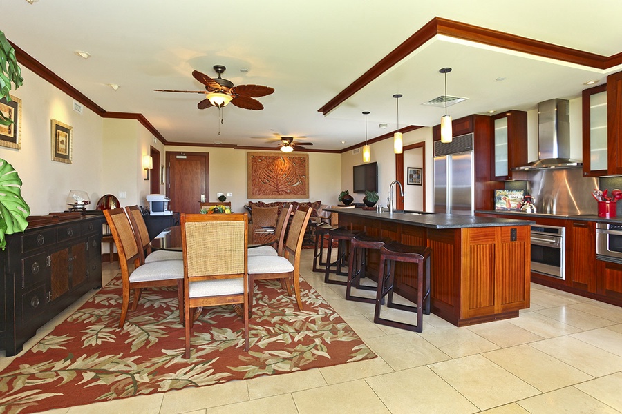 An open floor plan with seating at the kitchen bar.