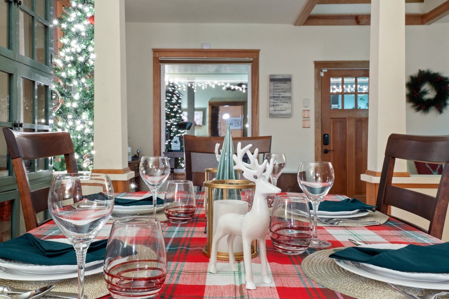 A close-up of holiday table settings with reindeer accents, ideal for festive gatherings.