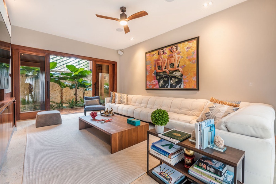 Comfortable living area with seamless transition to the lush outdoor surroundings.