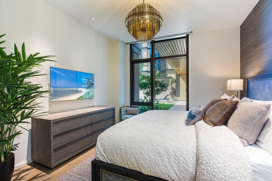 Drift off in your serene bedroom with modern touches, warm lighting, and peaceful garden views through your private window.