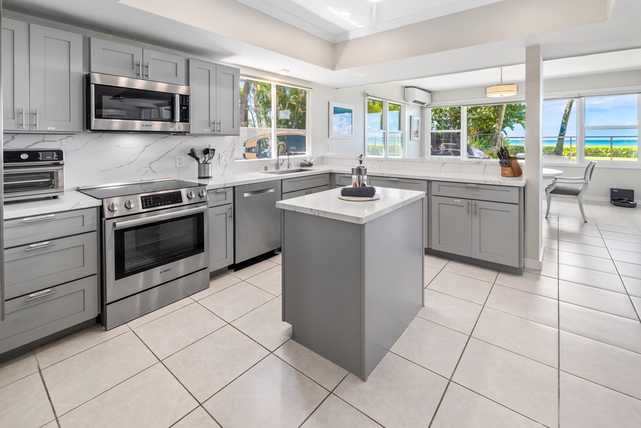 Modern kitchen with stainless steel appliances and a bright, open layout.