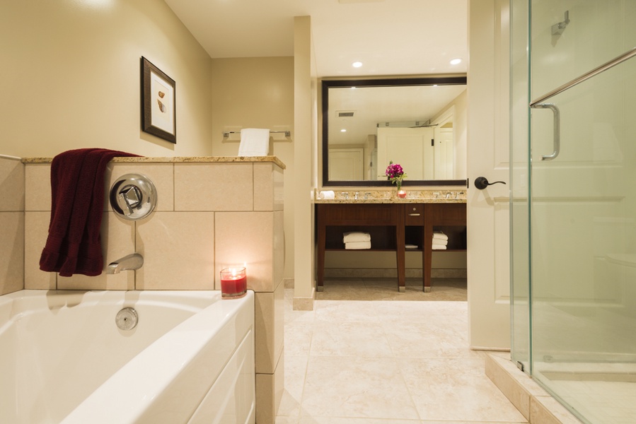 The en-suite bathroom is elegantly designed, featuring a soaking tub and spacious vanity, creating a spa-like atmosphere for ultimate relaxation.