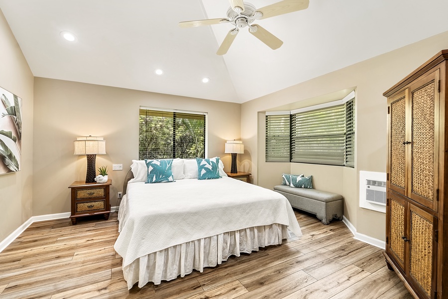 Second floor primary bedroom equipped with King bed, A/C, TV, and ensuite