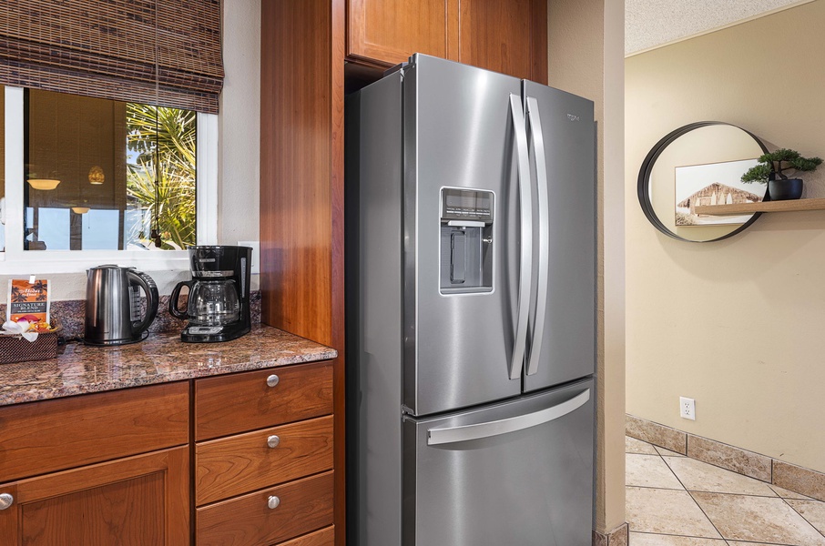 Dual door fridge for ample storage and a coffee corner adjacent to it!