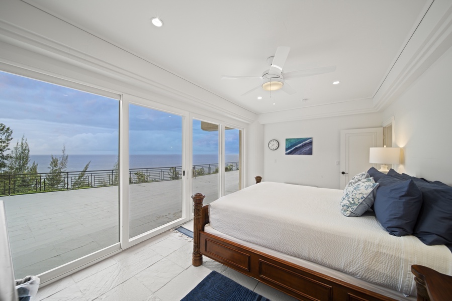 Guest Room #5 (1st floor) w/king bed, ocean views, deck & shared full bath.