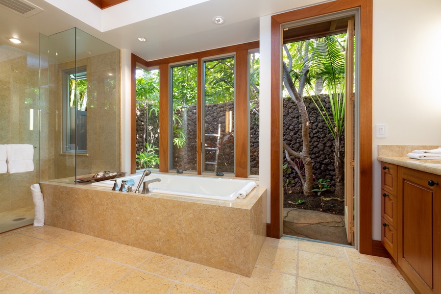 Alternate view towards the oversized soaking tub, walk-in shower & tropical atrium