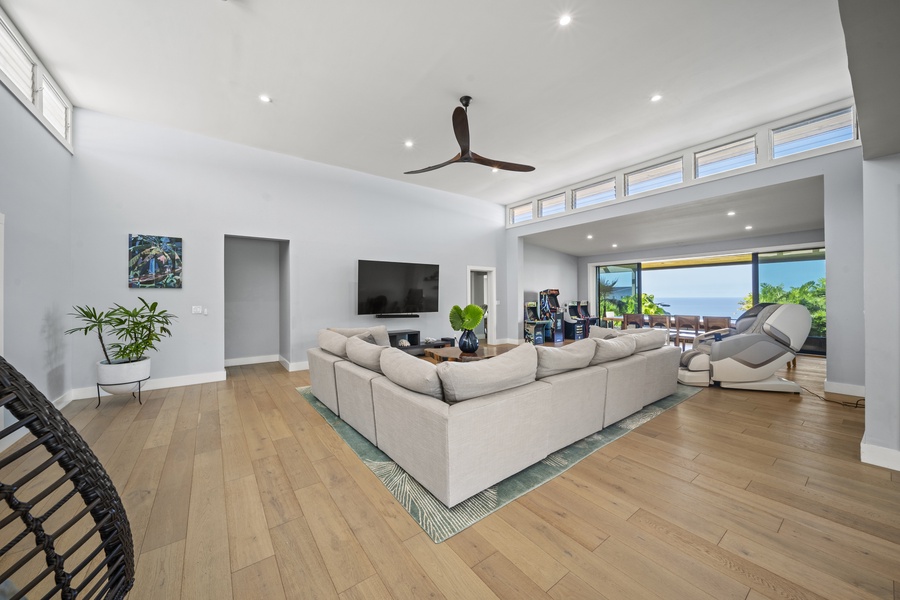 View from the kitchen to the spacious living and dining area, highlighting the seamless layout.