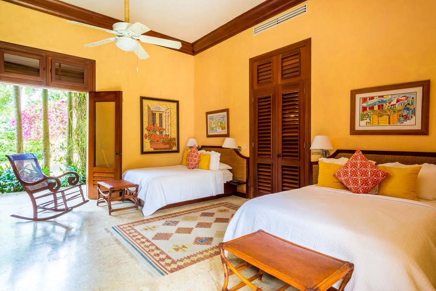 The other guest bedroom also has two double-sized beds.