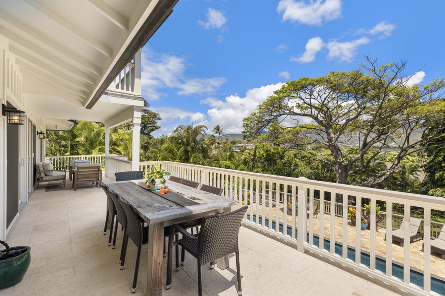 Enjoy outdoor dining for 8 on the deck with pool views