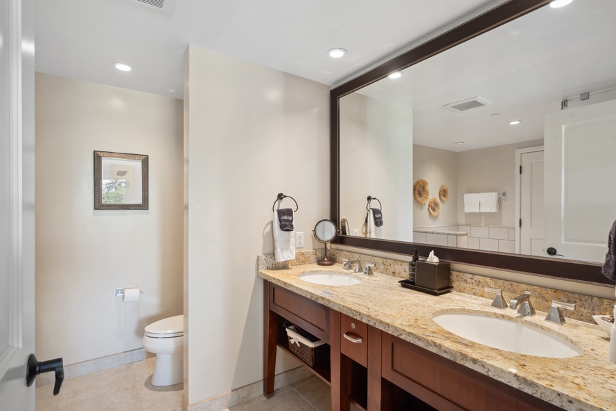 The second bathroom at Honua Kai Konea 204 features granite counters and thoughtful, stylish design.