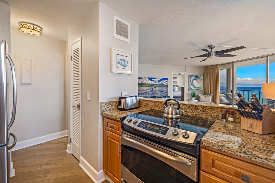 The kitchen includes a modern stove and sleek granite countertops, offering a stylish and functional space for cooking meals.