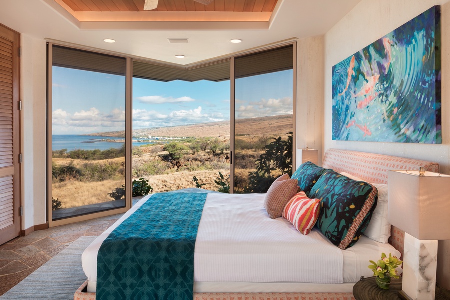 Third bedroom with king bed, sliding glass doors, ocean views, flat-screen TV, and en suite bath.