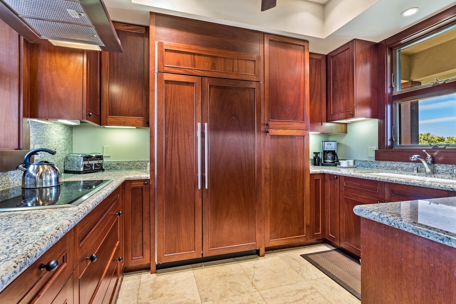 Elegant wood paneling and an ocean view from the kitchen sink.