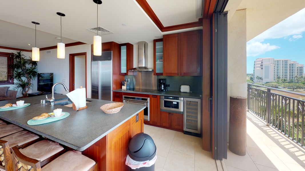The fully equipped kitchen with stainless steel appliances.