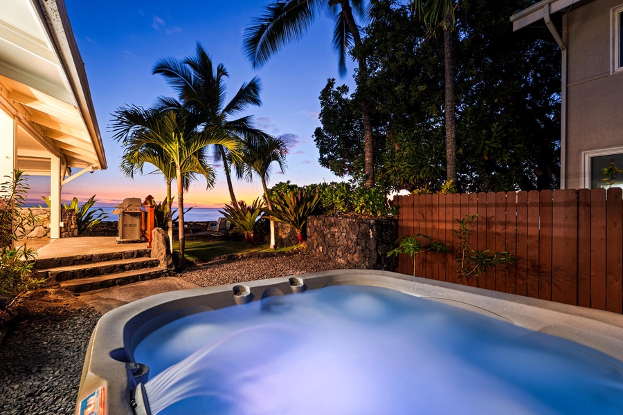 Relax and rejuvenate in the bubbling hot tub surrounded by swaying palms.