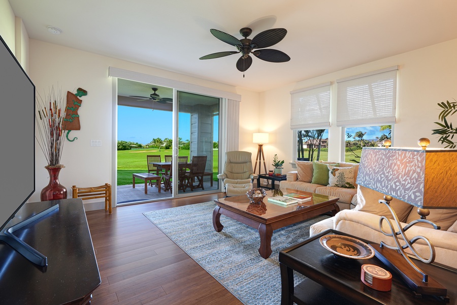 Inviting living space with sliding doors that open to a scenic golf course view.