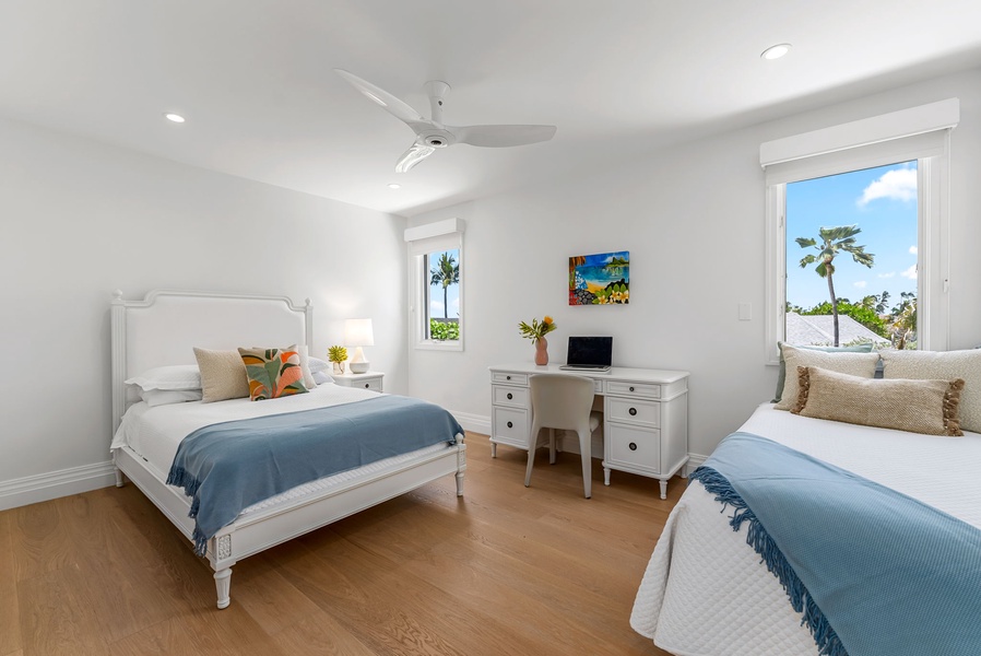 A double bed and twin make this bedroom ideal for kids or friends, complete with tropical touches and natural light.