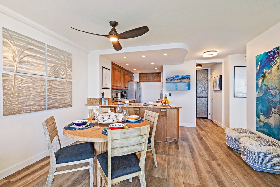 A modern, open-concept kitchen and dining area offers a welcoming space for meals and gatherings.