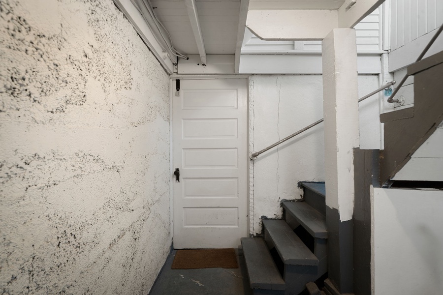 Enter through this practical interior stairwell connecting the home's living spaces.