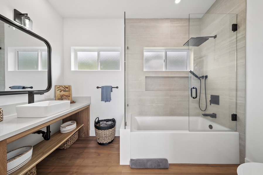 The chic minimalist-style ensuite bathroom offers a spa-like retreat.