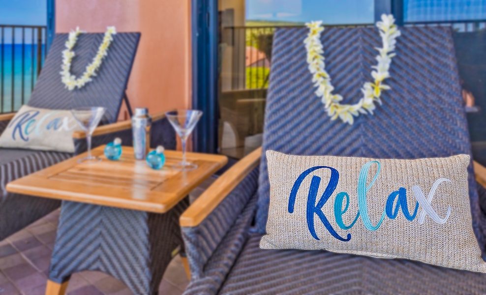 Relax and unwind on the lanai, with comfortable seating and a refreshing drink, while enjoying the tropical breeze.