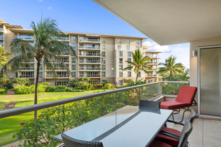Gather for tropical meals on the spacious lanai of Honua Kai Konea 204, surrounded by swaying palms.