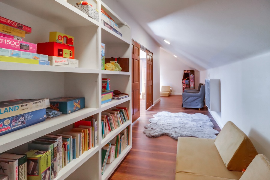 This delightful nook is filled with books and toys, creating a magical space for children to explore while adults enjoy their well-deserved relaxation just steps away.