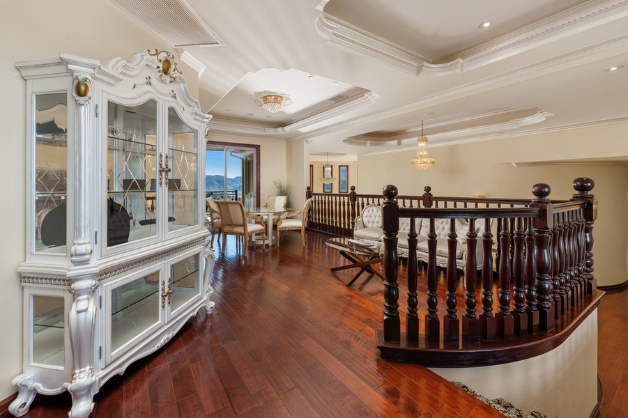 The curved staircase and built-in cabinetry give this landing a little drama.