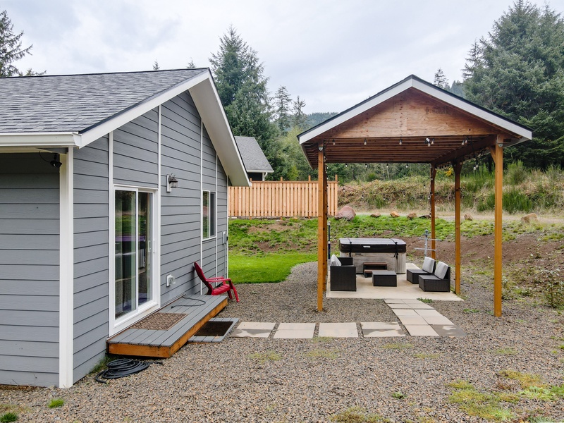 Our vacation rental home in Nehalem, Oregon boasts a private hot tub for indulging in complete relaxation after a long day of exploring the stunning beaches and charming town.