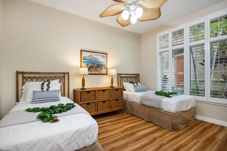 Retreat to a third guest bedroom with twin beds, ideal for relaxing after a day of exploring.