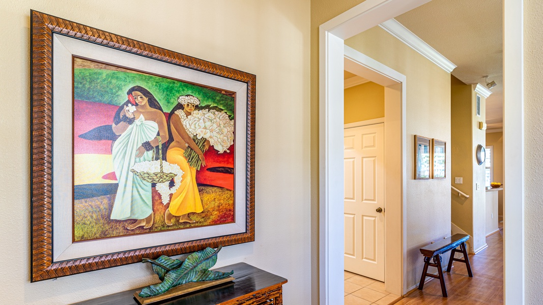 The entry of the home with framed art.