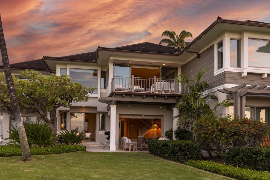 Back of this stunning villa showcasing the upper and lower lanais.