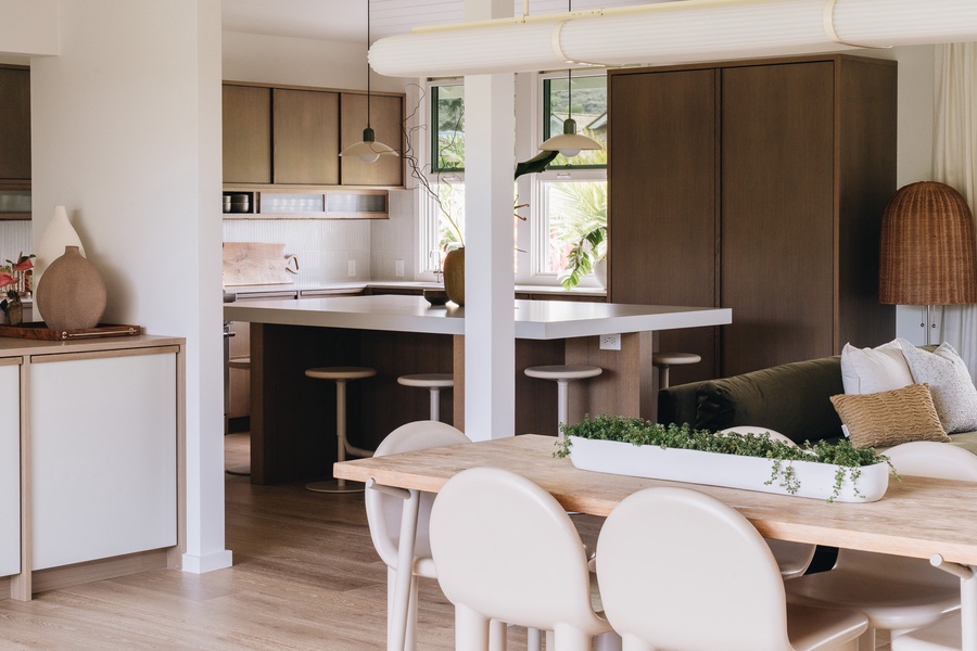 The dining area flows effortlessly into the kitchen, creating a welcoming space for meals and conversation.