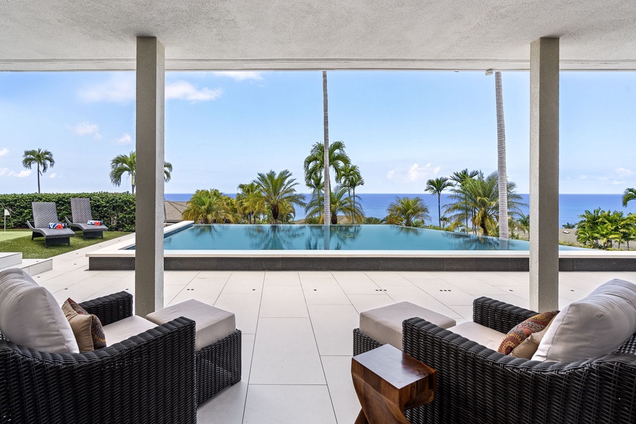 Ocean-view lounge with infinity pool in sight, offering front-row seating to nightly sunsets and sweeping coastal beauty.