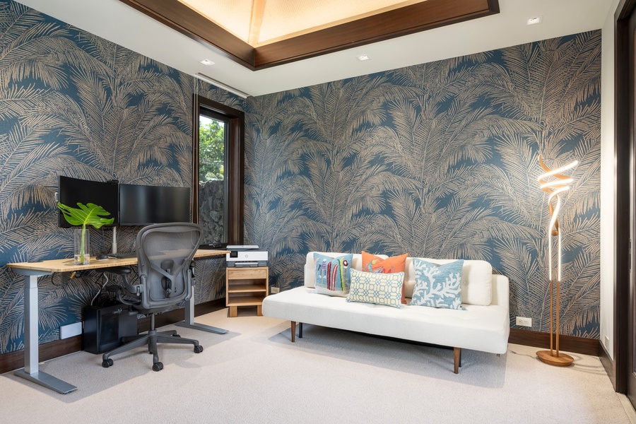 Work comfortably in your stylish home office featuring tropical palm wallpaper, modern furniture, and warm ambient lighting.