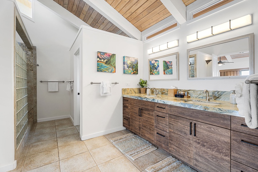 Start your day in a bright, spacious bathroom with a walk-in shower and clean design.