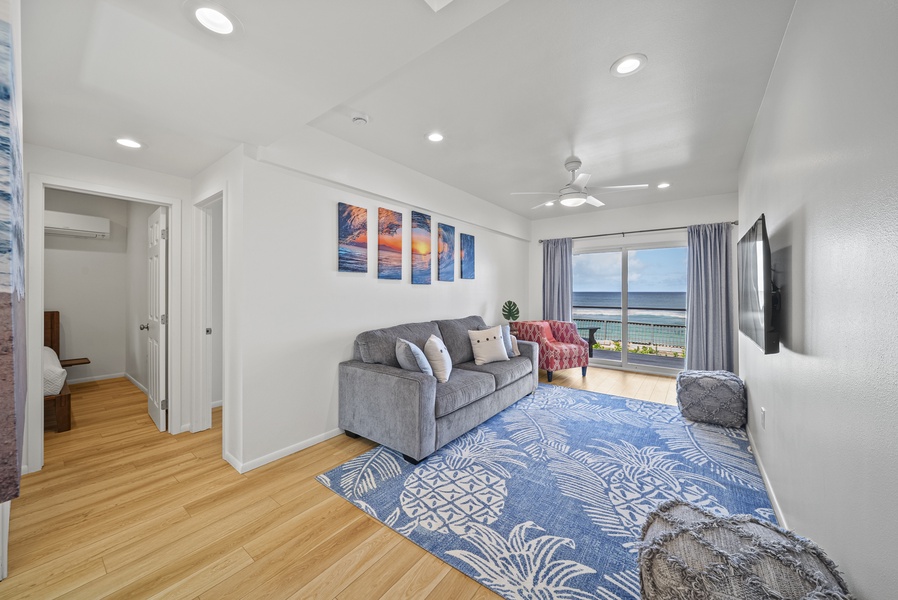 Downstairs lounge with ocean views, comfortable seating, and space for movie nights or relaxing with the sound of the waves. Sofa pulls out to queen bed for more sleeping arrangements.
