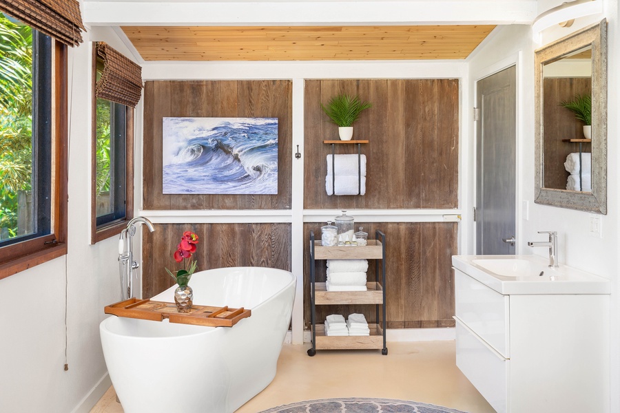 Indulge in the spa-like bathroom with a soaking tub, natural textures, and modern design.