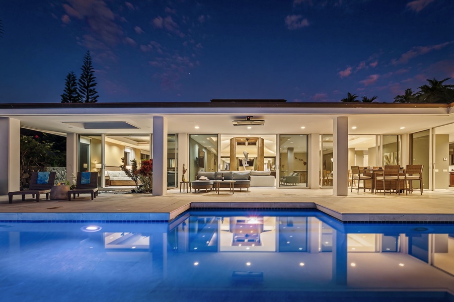 Take an evening dip in the glowing pool just steps from your open-air living space.