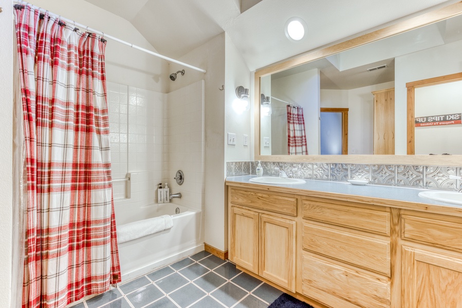 Guest ensuite has a tub/shower combo, and plenty of space.
