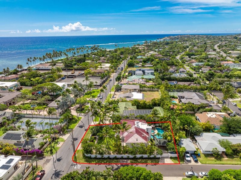 Aerial view with property boundary highlighted, showcasing the villa’s spacious grounds and nearby amenities.