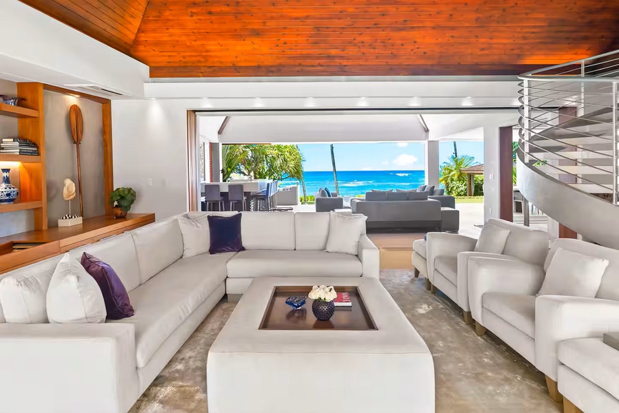 Slide the glass walls back and the great room opens straight to the sea.