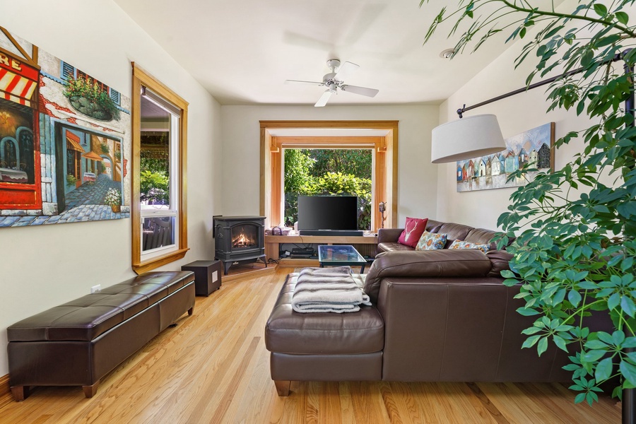 Cozy family room featuring a fireplace and sectional sofa, a great spot for movie nights or relaxation.