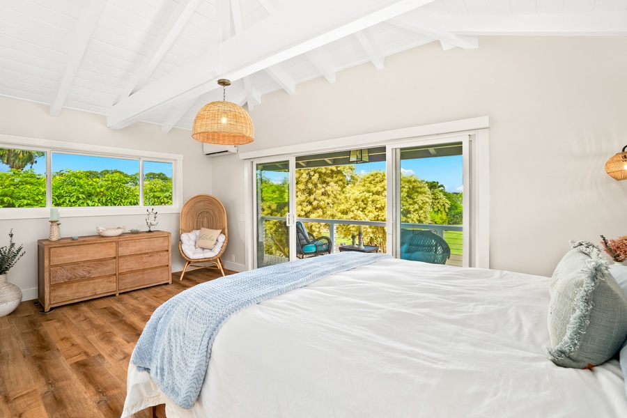 Bright and inviting, this bedroom features a sliding barn door and warm wooden accents.