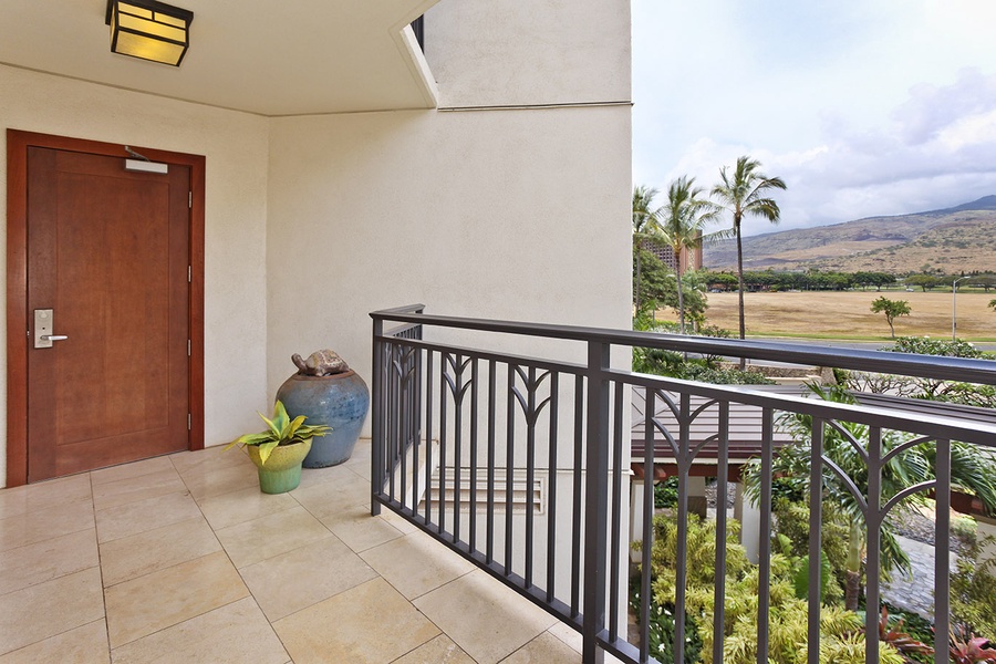 The front door and walkway offer a welcoming entrance to your luxurious Ko Olina retreat.Take in the breathtaking sunrises and sunsets from the spacious lanai, surrounded by tropical landscapes.