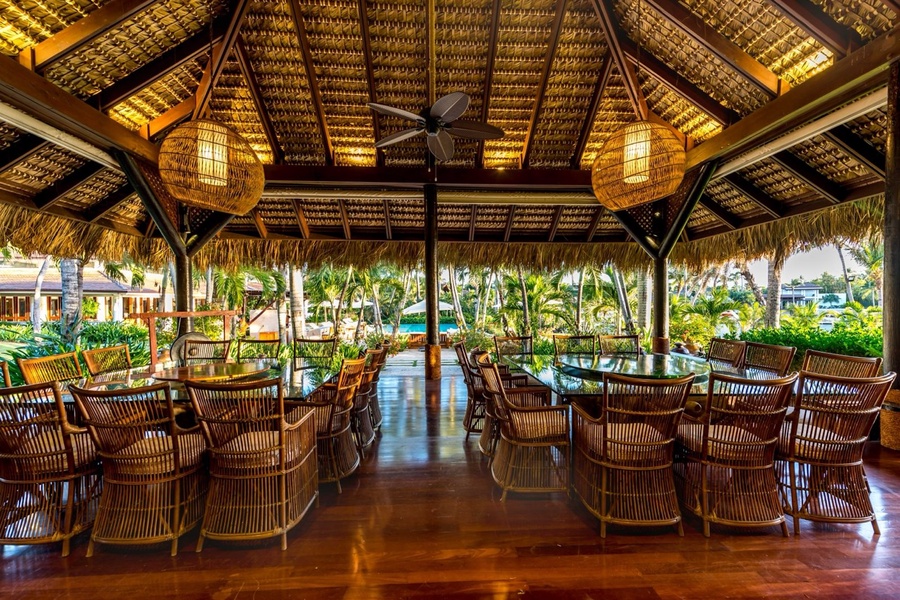 A perfect setting for open-air dining with stunning garden and pool views.