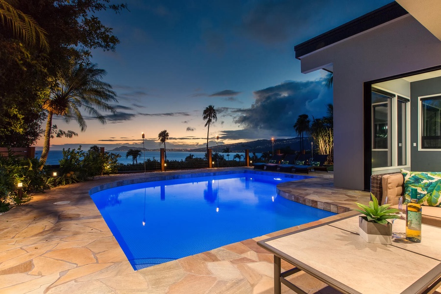 Twilight serenity, where pool reflections meet the stars.