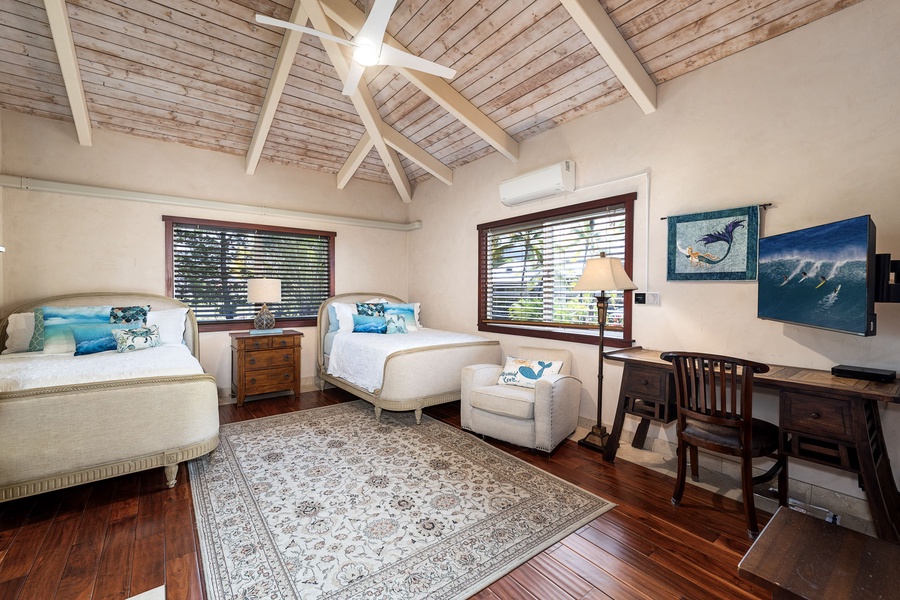 Bright  bedroom with Smart TV, vaulted ceilings and island decor—perfect for kids, teens, or flexible sleeping needs.