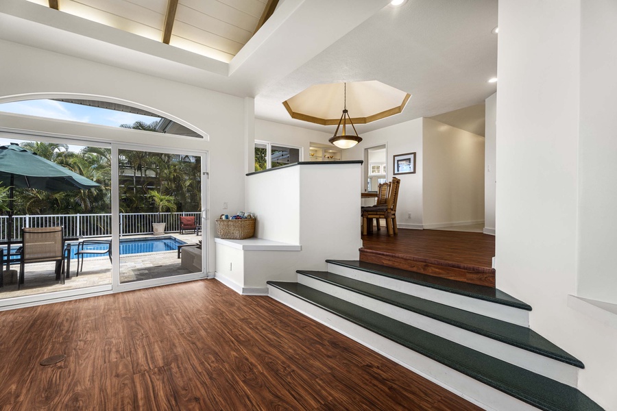 Steps leading from the kitchen and dining to the living room